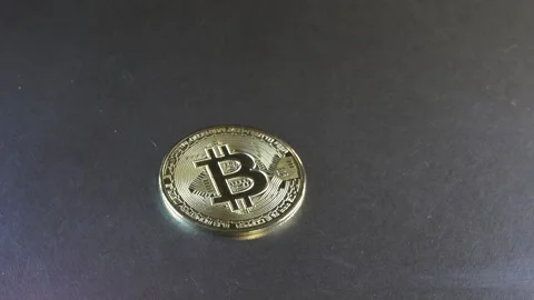 Bitcoin falls on a metal surface Stock Footage 152926661