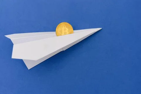 Bitcoin flying on paper plane Stock Photos