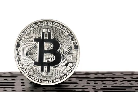 Bitcoin in front of computer board Stock Photos