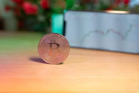 Bitcoin gold coin - crypto chart on a smartphone - cryptocurrency concept Stock Photos