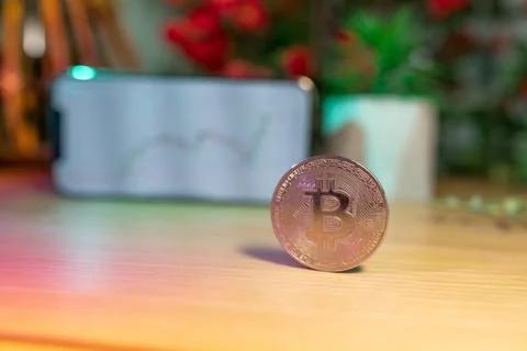 Bitcoin gold coin - crypto chart on a smartphone - cryptocurrency concept Stock Photos