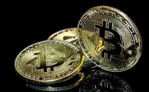 Bitcoin, Golden Bitcoins on a black background .Photo new virtual money Stock Photos