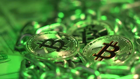 Bitcoin in green light. Crypto currency Gold Bitcoin, BTC, Bit Coin. Macro shot Video stock 143538941