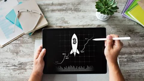 Bitcoin growth rocket icon on screen. Cryptocurrency and blockchain concept. 库存照片