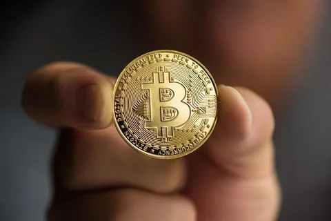 Bitcoin in hand close up Stock Photos