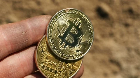 BitCoin in hand of  man worker fall down. Slow motion Video stock 91295971