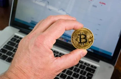 Bitcoin in hand Stock Photos