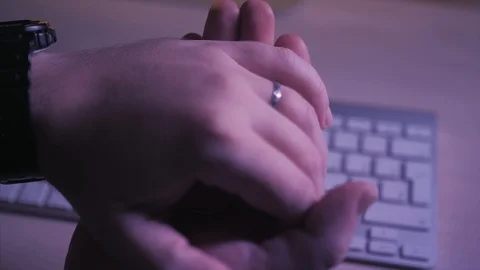 Bitcoin in the hands on the keyboard background Stock Footage 87329142