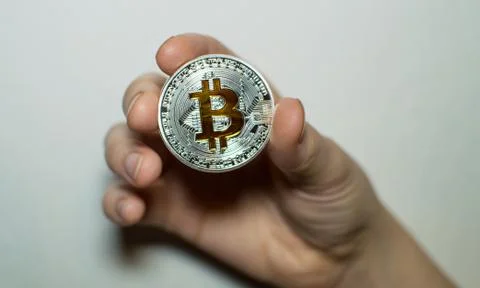 Bitcoin in hands Stock Photos
