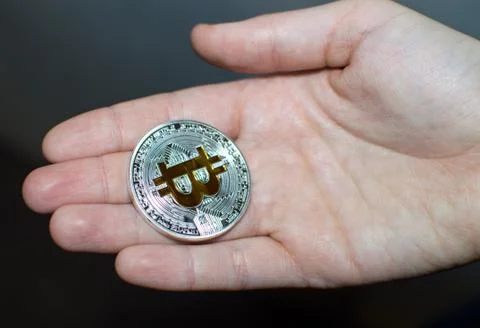 Bitcoin in hands Stock Photos