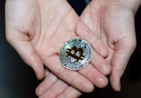 Bitcoin in hands Foto stock