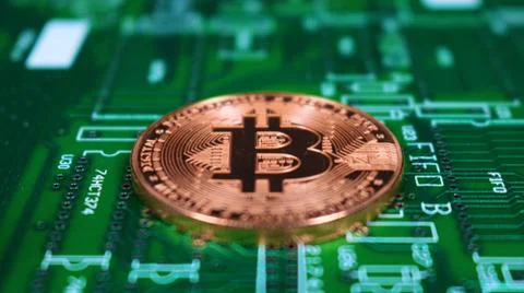 Bitcoin Image, Single Copper Coin, Laying on PCB motherboard. Stock Photos