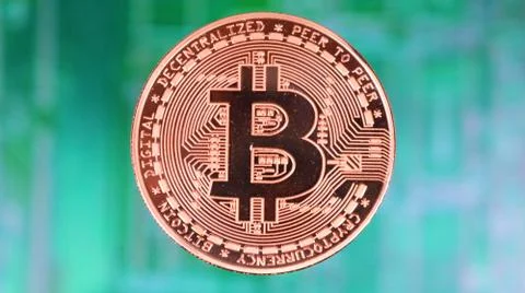 Bitcoin Image, Single Copper Coin, Over Blurred PCB Motherboard. Stock Photos