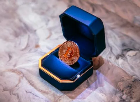 Bitcoin inside the box for the ring Stock Photos