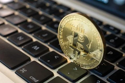 Bitcoin on laptop Stock Photos