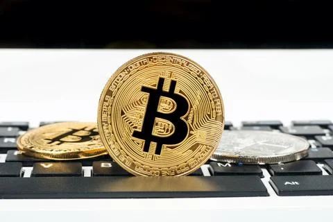 Bitcoin on laptop Stock Photos