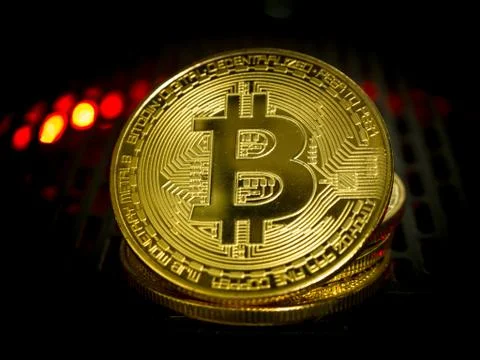 Bitcoin is located on the Power Supply with backlight concept. Stock Photos