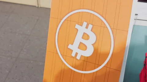 The Bitcoin logo prominently displayed at a major cryptocurrency event Video stock 305079986