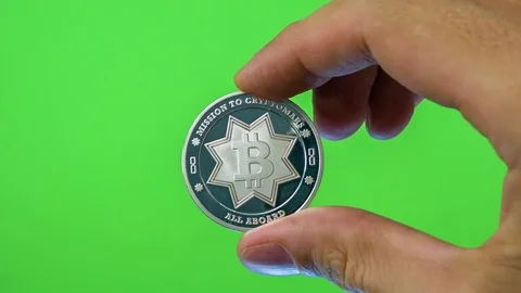 Bitcoin in man hand isolated on green screen chromakey background Video stock 83769340