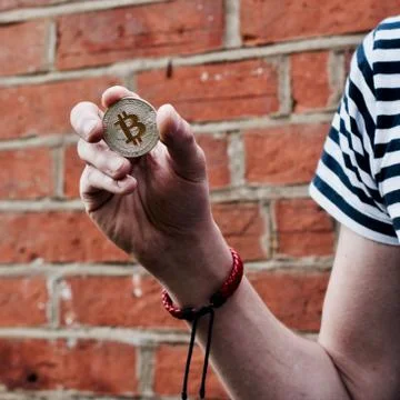 Bitcoin in man hand Stock Photos