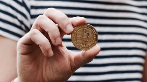 Bitcoin in man hand Stock Photos