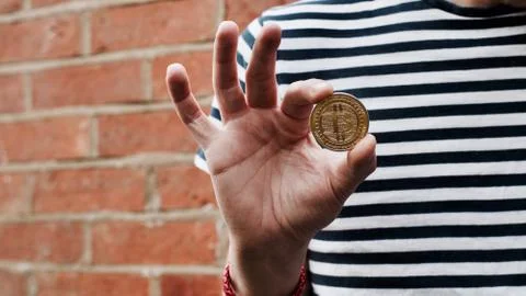 Bitcoin in man hand Stock Photos