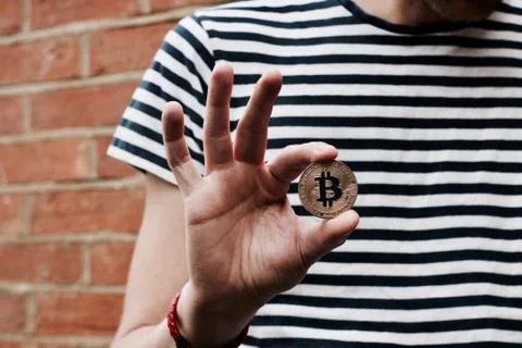 Bitcoin in man hand Stock Photos