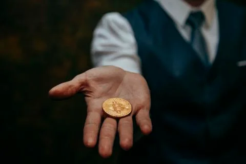 Bitcoin in a man's hand Stock Photos