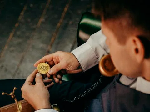 Bitcoin in a man's hand Stock Photos