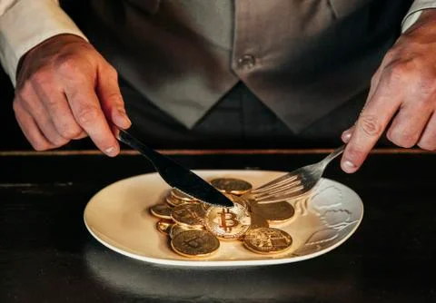 Bitcoin in a man's hand Stock Photos