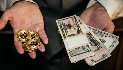 Bitcoin in a man's hand Stock Photos