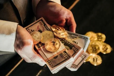 Bitcoin in a man's hand Stock Photos