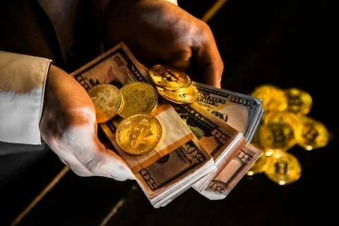 Bitcoin in a man's hand Stock Photos