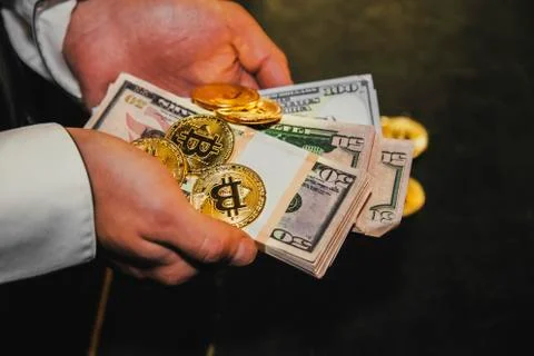 Bitcoin in a man's hand Stock Photos