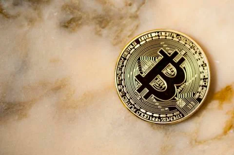 Bitcoin on marble background Stock Photos