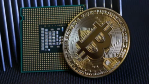 Bitcoin mining. BTC and CPU central processor with an aluminum heatsink Stock Footage 161011736