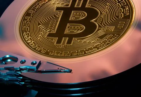 Bitcoin mining concept using hard drive Bitcoin superimposed on the discs ... Stock-Fotos