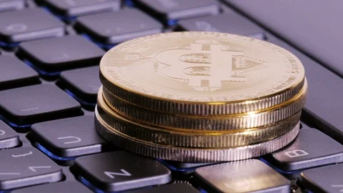 Bitcoin mining. Cryptocurrency on laptop keyboard Stock Footage 86376467