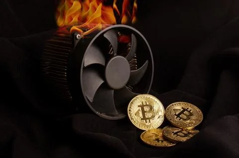 Bitcoin mining device and some golden coins and a flame as a heat Stock Photos