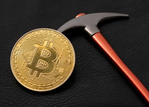Bitcoin Mining With a Pickaxe, BTC Cryptocurrency Mining Concept Stock Photos