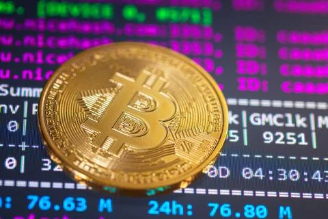 Bitcoin with mining program in the background Stock Photos