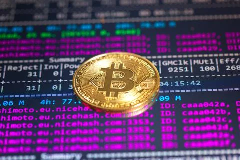 Bitcoin with mining program in the background Stock-Fotos