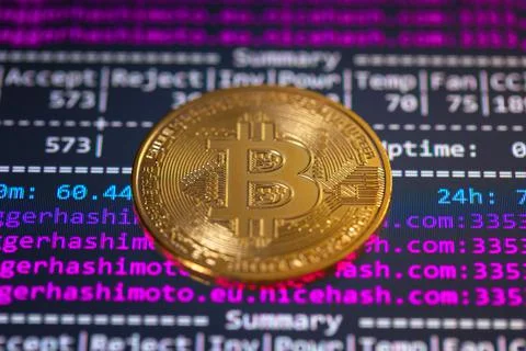 Bitcoin with mining program in the background Foto stock