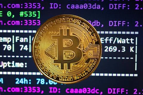 Bitcoin with mining program in the background Stock-Fotos