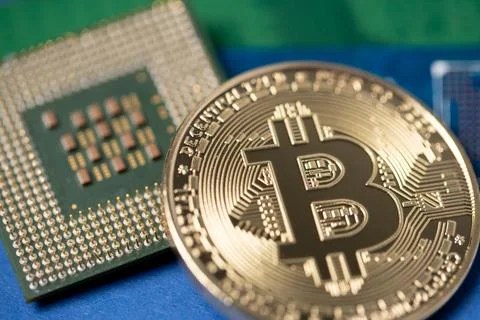 Bitcoin next to CPU processor. Crypto mining concept 스톡 사진