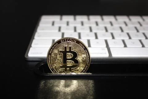 Bitcoin is an open source peer-to-peer electronic cash system that uses Stock Photos