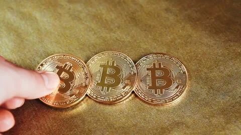 Bitcoin or cryptocurrency on golden background Stock Footage 85608631
