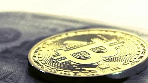 BITCOIN OVER 100 DOLLAR BILL CAMERA SLIDE Stock-Footage 83225815