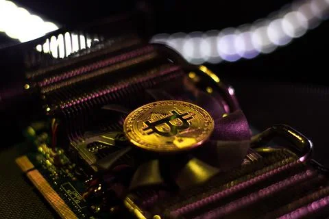 Bitcoin over graphic videocard Stock Photos