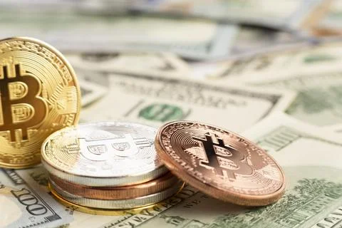 Bitcoin pile top dolar bills Resolution and high quality beautiful photo Stock Photos